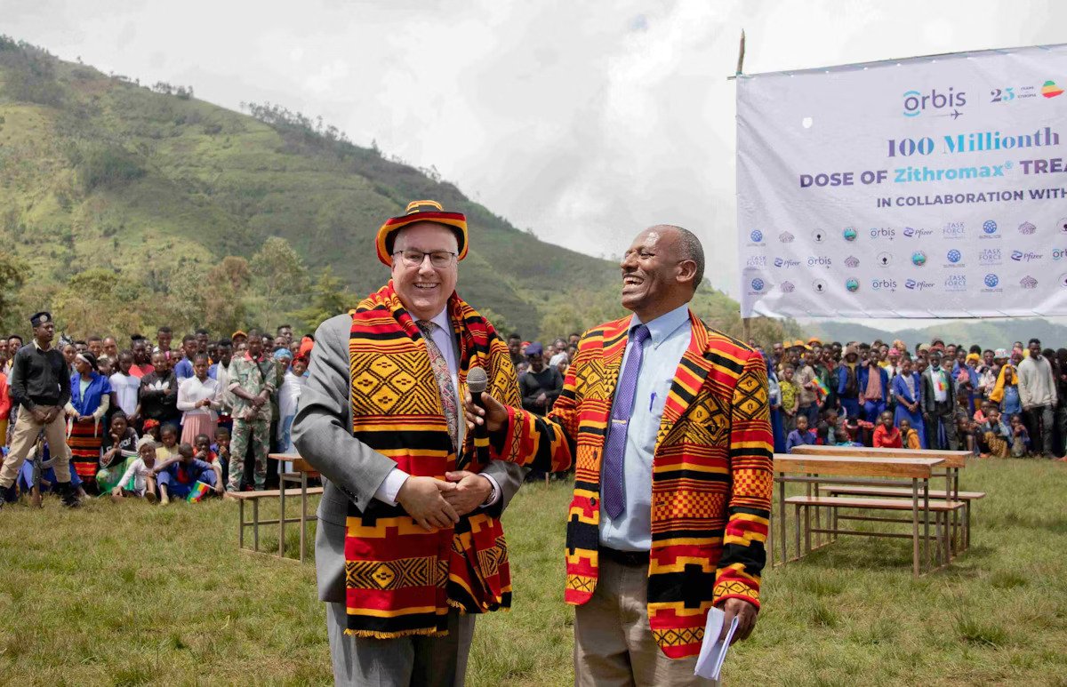 Orbis International President and CEO Derek Hodkey and Orbis Ethiopia Country Director, Dr. Alemayehu Sisayin in Ethiopia at the time of Orbis’s administration of its 100-millionth dose of trachoma-fighting antibiotics
