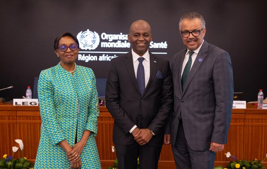 Dr. Faustine Engelbert Ndugulile stands with Dr Moeti, present Regional Director of WHO AFRO and Dr Tedros Adhanom Ghebreyesus, WHO Director-General