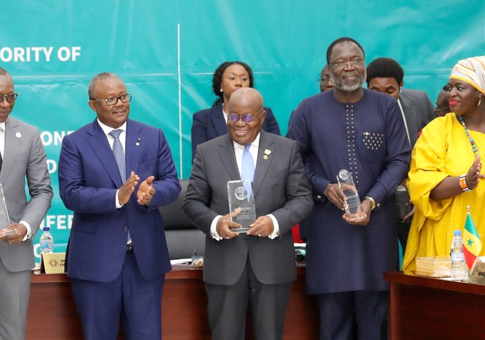Thoko Elphick-Pooley stands with Presidents and leaders from ECOWAS holding their awards tackling NTDs