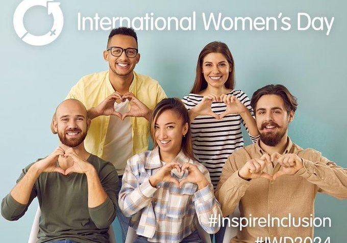 Five individuals show the International Women's Day heart
