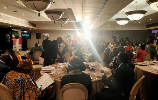 Ministers sit around tables ready for side event