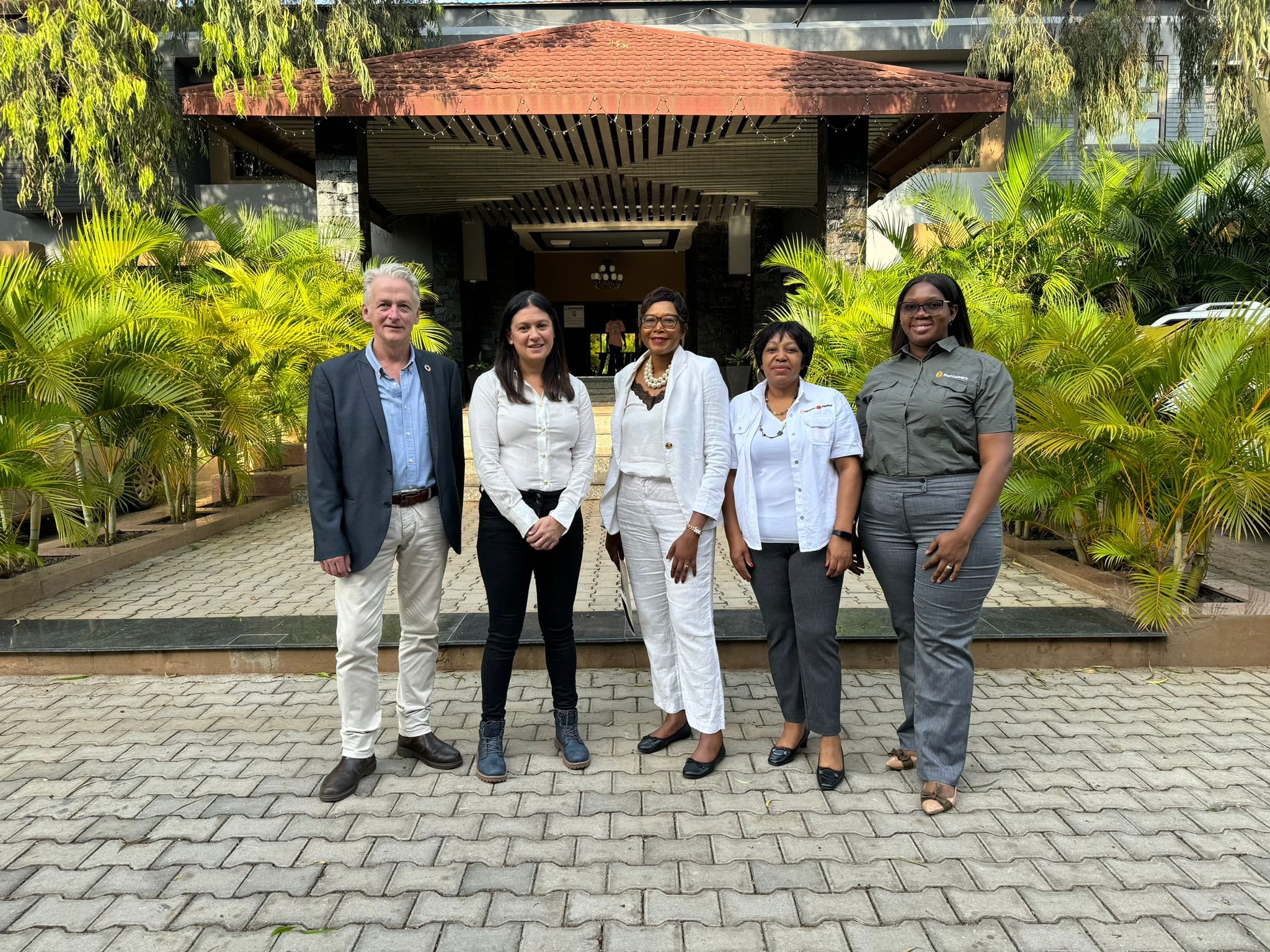 Stuart Halford of Uniting to Combat NTDs with Lisa Nandy MP, Uniting to Combat NTDs Board Member Dr Francisca Mutapi, Glenda Mulenga, Country Director for Zambia at Sightsavers, and Kaluba Lombe, Inclusive Eye Health Manager at Sightsavers